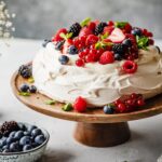 Delicious vanilla pavlova with vanilla cream and berries.