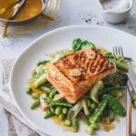 Delicious orange - vanilla glazed salmon with green vegetables.